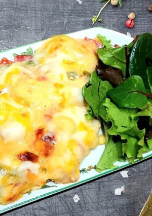 A picture of Fish mix with sweet peppers in white sauce.
