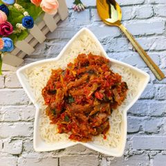 A picture of Steamed Basmati Rice with Smoked Fish Pepper Sauce.