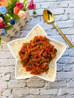 A picture of Steamed Basmati Rice with Smoked Fish Pepper Sauce.