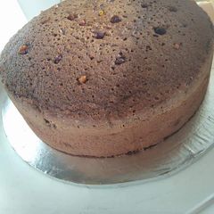 A picture of Chocolate cake with rasins.