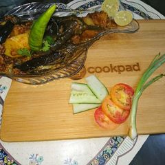 A picture of Egg plant like leg piece with potato.