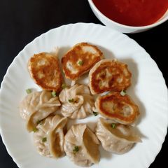 A picture of Kothey Momo with Roasted Garlic Tomato Chutney (Veg).