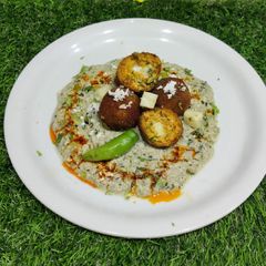 A picture of Cheese Paneer Kofta in paneer Gravy.