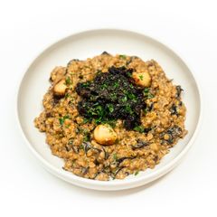 Creamy Pearl Couscous with Wild Mushrooms and Wine-Braised Sun-Dried Tomatoes A picture of Creamy Pearl Couscous with Wild Mushrooms and Wine-Braised Sun-Dried Tomatoes.