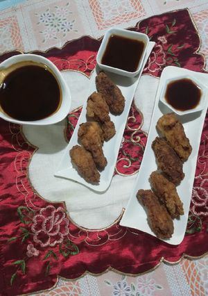 Una foto de Alitas brostizadas con salsa thai