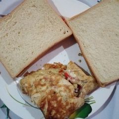 A picture of Bread and Fried Vegetable Egg #teamabuja.