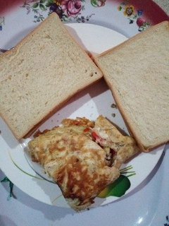 A picture of Bread and Fried Vegetable Egg #teamabuja.