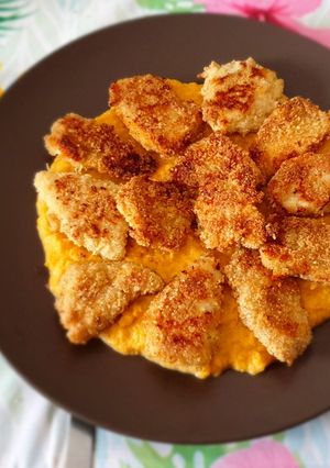 A picture of Oven-Baked Almond-Crusted Chicken Breast with Pumpkin Cream.