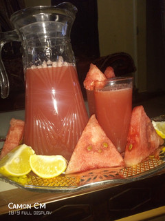 A picture of Water melon and orange juice.
