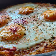 A picture of Hash Brown with Baked Eggs.