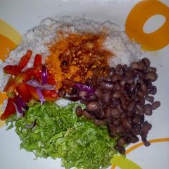 A picture of Dambu with beans and salad.