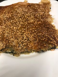Una foto de 321. Pastelitos de espinacas y queso feta (principal pizza)