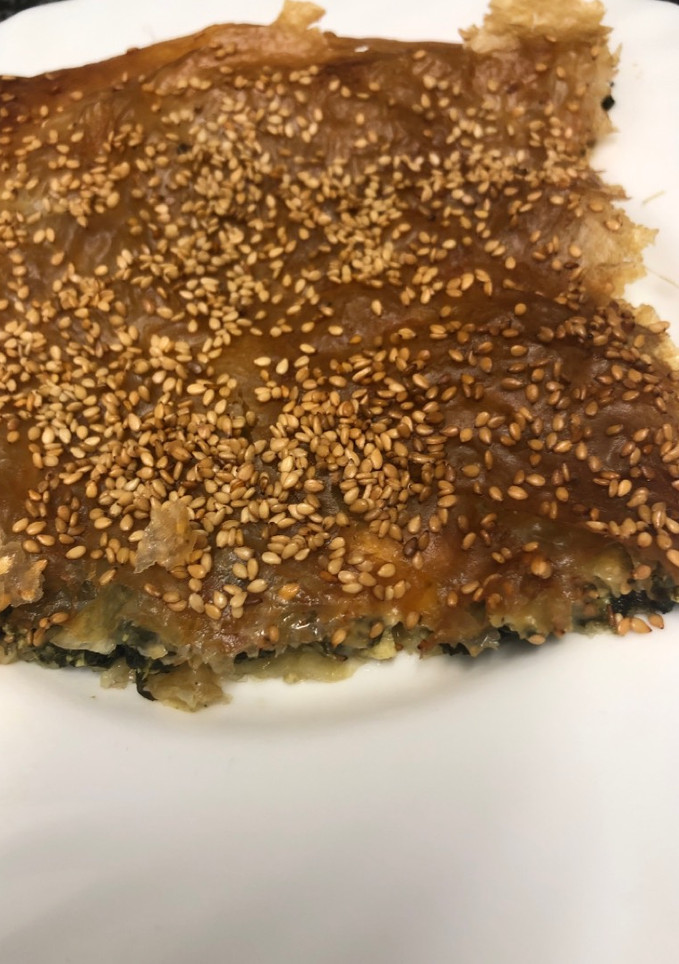 Una foto de 321. Pastelitos de espinacas y queso feta (principal pizza)