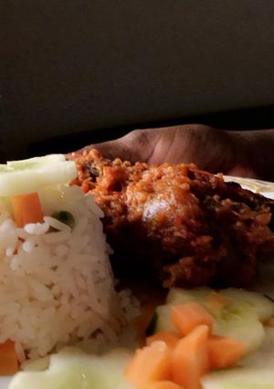 A picture of Coconut White Rice and chicken stew.