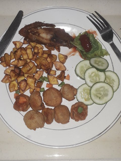 A picture of French fries with chicken.