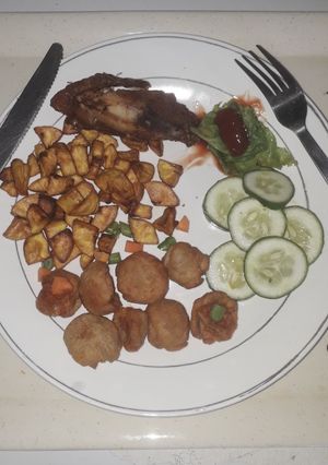 A picture of French fries with chicken.