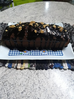 Una foto de Budín de banana con cobertura de ganache de chocolate.❤😋😋
