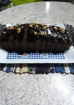 Una foto de Budín de banana con cobertura de ganache de chocolate.❤😋😋