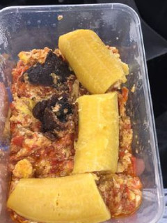 A picture of Boiled plantain with meat and egg sauce.