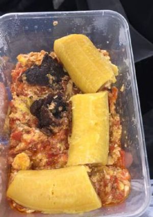 A picture of Boiled plantain with meat and egg sauce.