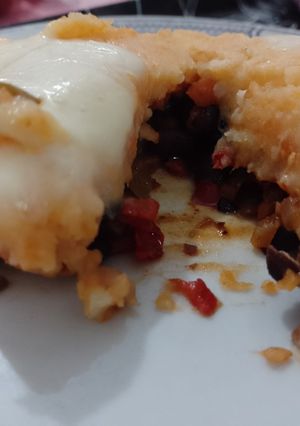 Una foto de Pastel de papa, boniato y porotos negros