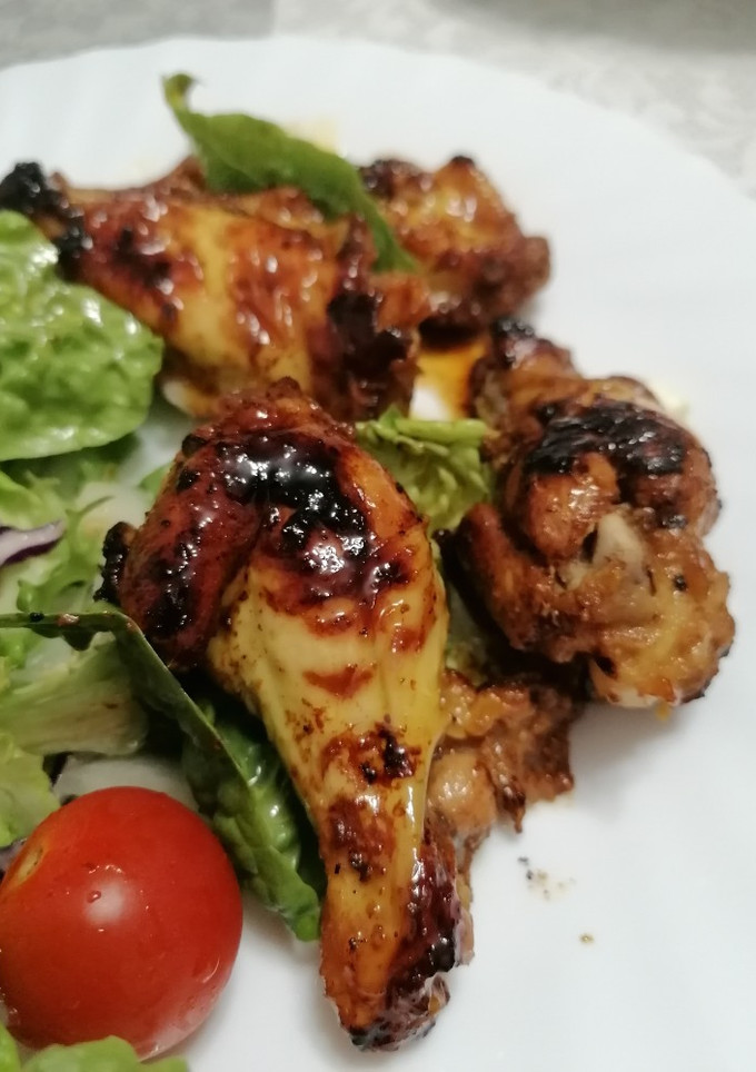 Una foto de 343. Alitas y muslitos pollo en adobo agridulce al punto picante
