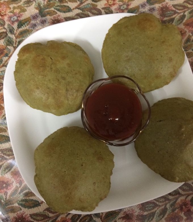 A picture of #Palak (spinach and cottage cheese)paneer poori.