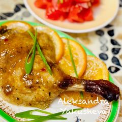 A picture of Duck Legs with Glazed Oranges.