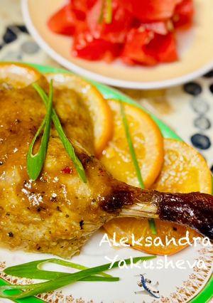 A picture of Duck Legs with Glazed Oranges.