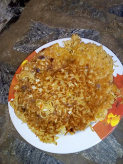 A picture of Egg coated leftover noodles.