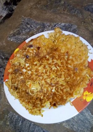 A picture of Egg coated leftover noodles.