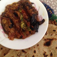 Baigan or Hari Mirch ka Salan with makai Ki roti A picture of Baigan or Hari Mirch ka Salan with makai Ki roti.