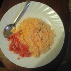 A picture of Carroted Rice with kachumbari.