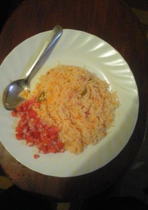 A picture of Carroted Rice with kachumbari.