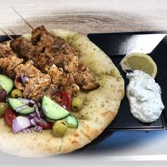 Greek Pork Souvlaki with Greek Salad and Flatbread A picture of Greek Pork Souvlaki with Greek Salad and Flatbread.