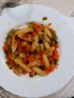 Una foto de "Ñoquis" con verduras