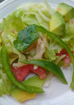 A picture of Green salad with avocado.