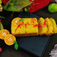 A picture of Orange strawberry squash flan.