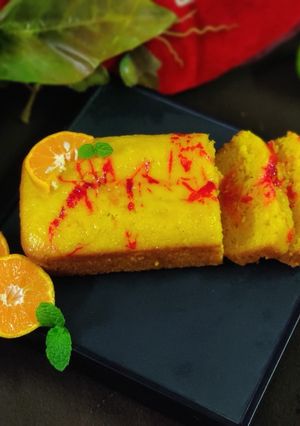 A picture of Orange strawberry squash flan.