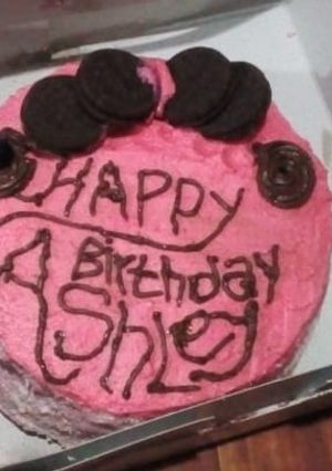 A picture of Chocolate Vanilla Layered Cake With Strawberry Flavored Frosting.