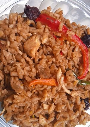 Una foto de Arroz espacial base arroz con coco y carnes