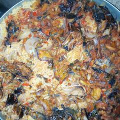 A picture of Jollof rice and dry fish.
