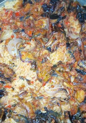 A picture of Jollof rice and dry fish.