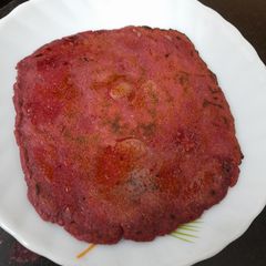 A picture of Navratan(9flours) beetroot Roti.