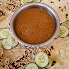 A picture of Roti serve with curry soup.