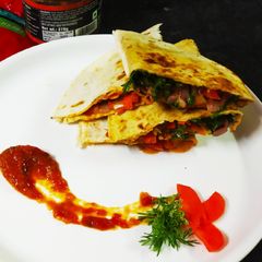 A picture of Mexcian tomato salsa Tortilla.