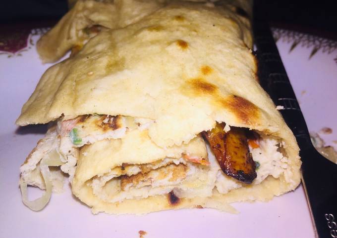 Fried egg and plantain wraped in pita bread