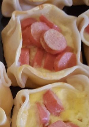 Una foto de Canastitas de salchichas y queso