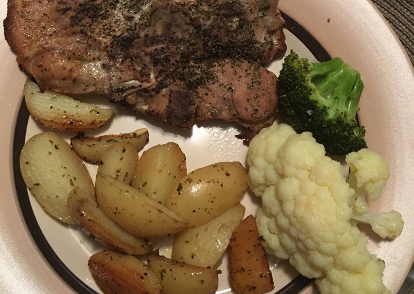 Pork chops with lemon roasted potatoes and veggies