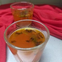 A picture of Orange rasam.